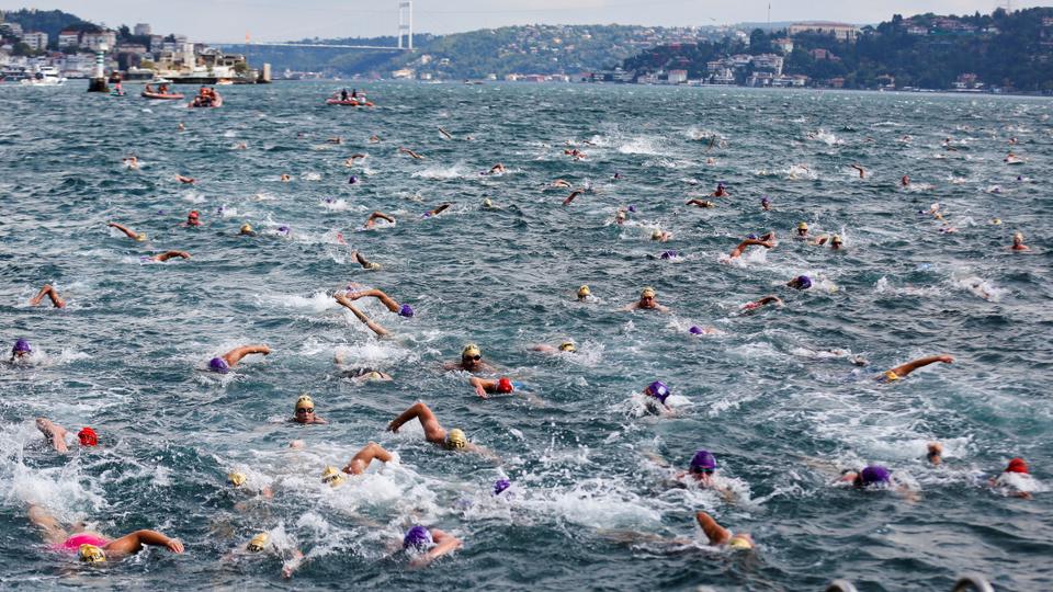Competitors participate in the 33rd Bosphorus Cross-Continental Swimming Race across the Bosphorus strait between Istanbul's Asian and European sides, Turkey on August 22, 2021.