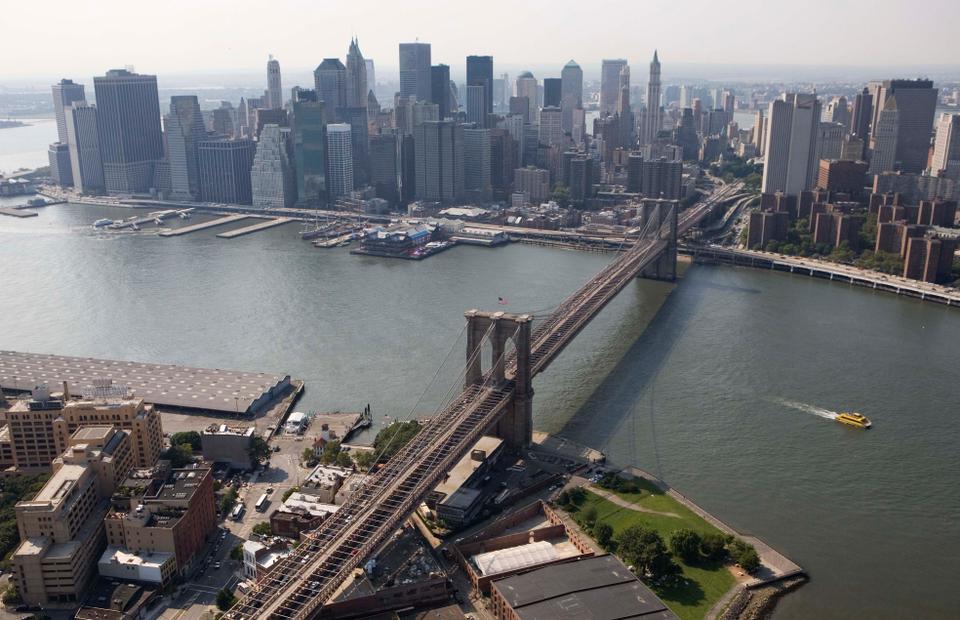The Brooklyn Bridge connects Brooklyn, foreground, and Manhattan in this aerial photo of New York.
