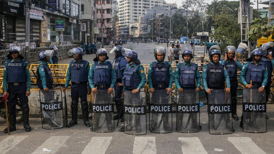 Police set up a roadblock near BNP's central office in Dhaka on December 8, 2022, ahead of a rally called for December 10 to force PM Sheikh Hasina to resign.
