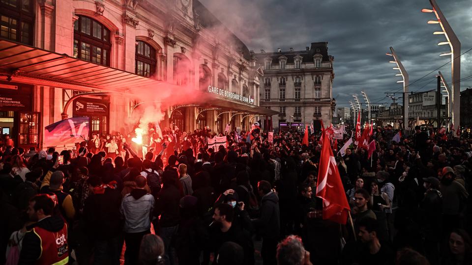 Protesters gather during a demonstration in Bordeaux, a day after the government pushed a contentious pension reform.