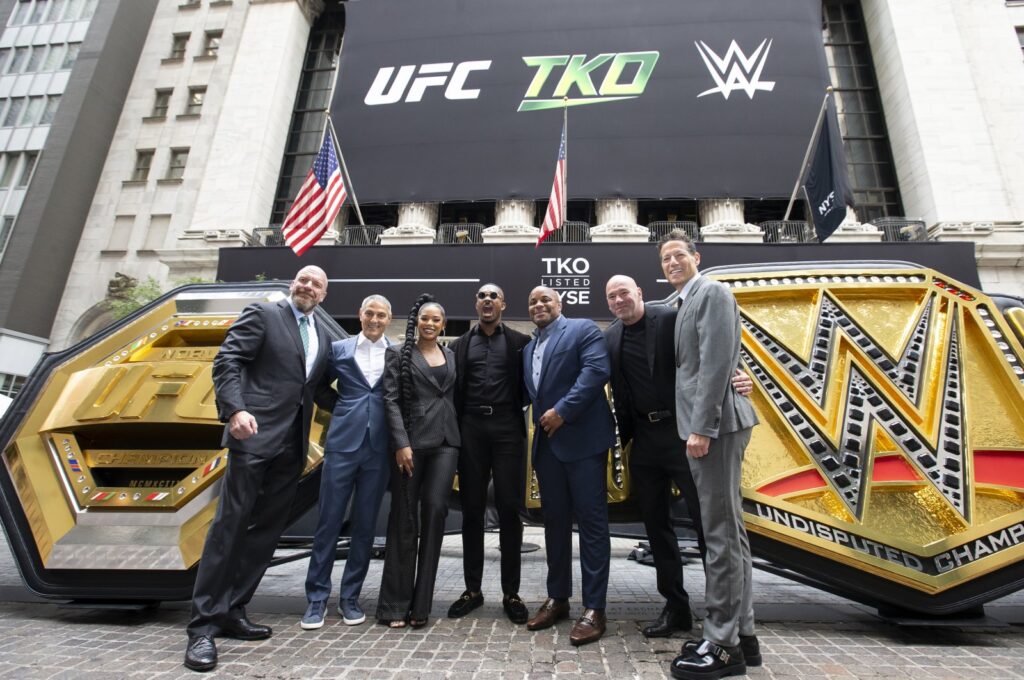 (L-R) WWE Chief Content Officer Paul Levesque (Triple H), TKO   Endeavor CEO Ariel Emanuel, WWE Superstars Bianca Belair and Montez Ford, UFC hall of famer Daniel Cormier, UFC CEO Dana White, and TKO   Endeavor President and COO Mark Shapiro pose outside the New York Stock Exchange during the TKO Group Holdings' listing, New York, US., Sept. 12, 2023. (Getty Images Photo)