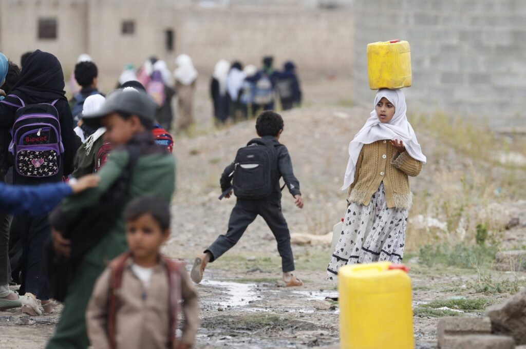 A Yemeni girl carrying a water jerrycan looks on on the outskirts of Sana'a, Yemen, Sept. 2, 2023. (EPA Photo)
