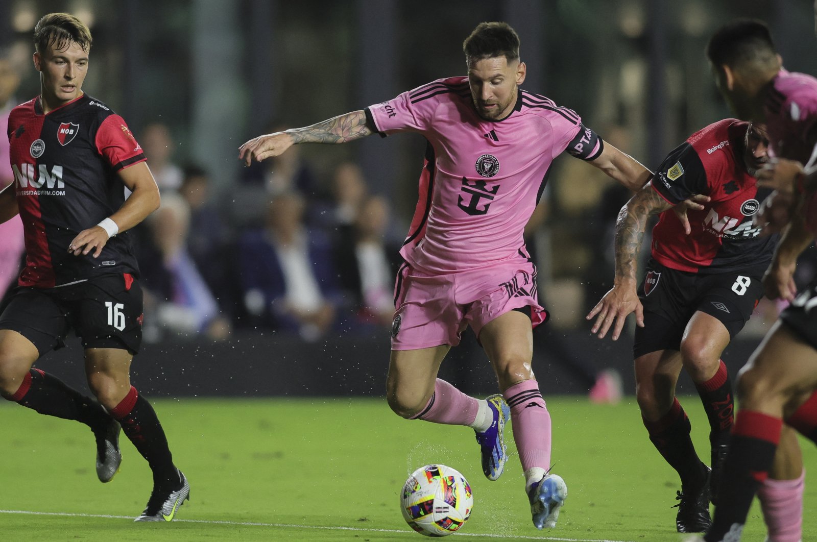 Inter Miami's Lionel Messi (C) dribbles the ball past Newell's Old Boys players during the first half at DRV PNK Stadium, U.S., Feb. 15, 2024. (Reuters Photo)