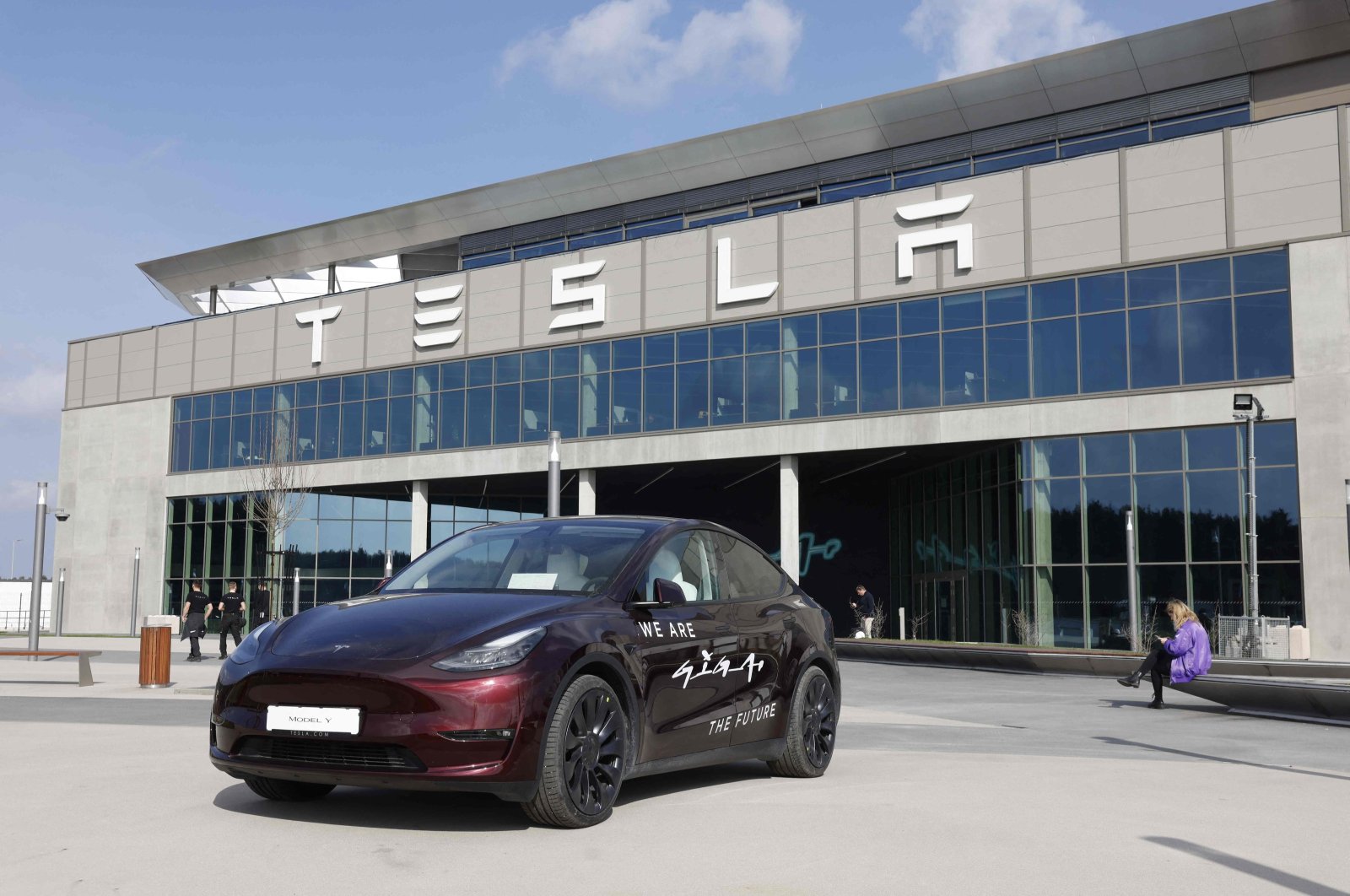 A Tesla Model Y car is parked in front of the company's plant as Tesla CEO Elon Musk visits the company's electric car plant in Gruenheide near Berlin, Germany, March 13, 2024. (AFP Photo)