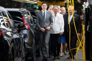 Canadian Prime Minister Justin Trudeau (Left), alongside Honda CEO Toshihiro Mibe (Center), and Ontario Premier Doug Ford (Right) tours the manufacturing line prior to an event at the Honda of Canada Manufacturing Plant 2 in Alliston, Ontario, Canada, April 25, 2024. (AFP Photo)