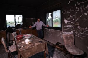 A Palestinian man gestures as he stands inside his kitchen in the aftermath of an attack by Israeli settlers in the occupied West Bank village of  Al-Mughayyir near Ramallah, Palestine, April 17, 2024. (AFP Photo)