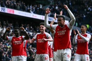 Arsenal's Gabriel Magalhaes (C) celebrates with teammates at the end of during the English Premier League football match against Tottenham Hotspur at the Tottenham Hotspur Stadium, London, U.K., April 28, 2024. (AFP Photo)