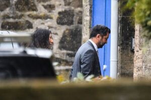 Scotland's First Minister Humza Yousaf (R), followed by his wife Nadia el-Nakla, arrives at Bute House ahead of a press conference, in Edinburgh, April 29, 2024. (AFP Photo)
