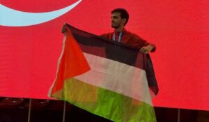 Turkish kung fu fighter Necmettin Erbakan Akyüz holds the Palestinian flag at the European Wushu Kungfu Championship, Istanbul, Türkiye, Dec. 16, 2023. (Necmettin Erbakan Akyüz on Instagram)