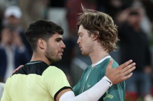 Russia's Andrey Rublev (R) greets Spain's Carlos Alcaraz after winning a 2024 ATP Tour Madrid Open tournament quarterfinals match, Caja Magica, Madrid, Spain, May 1, 2024. (AFP Photo)