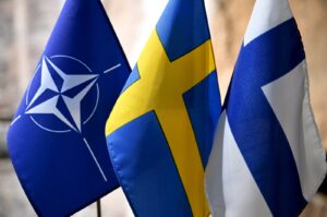 From left, flags of NATO, Sweden and Finland at the event "Finland, Sweden, and Ukraine in an Expanded EU" arranged by Swedish-Finnish Cultural Centre in Espoo, Finland, on March 26, 2024. (Reuters File Photo)