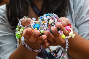 A fan of U.S. singer Taylor Swift, also known as a Swiftie, holds friendship bracelets as she arrives for the first of the pop star's six sold-out Eras Tour concerts at the National Stadium in Singapore, March 2, 2024. (AFP Photo)