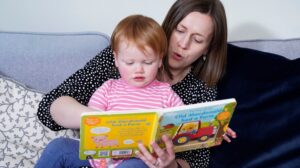 Jo Sandy reads to her daughter Opal, who was born deaf but can now hear and speak after taking part in a gene therapy trial, Oxfordshire, U.K. (dpa Photo)