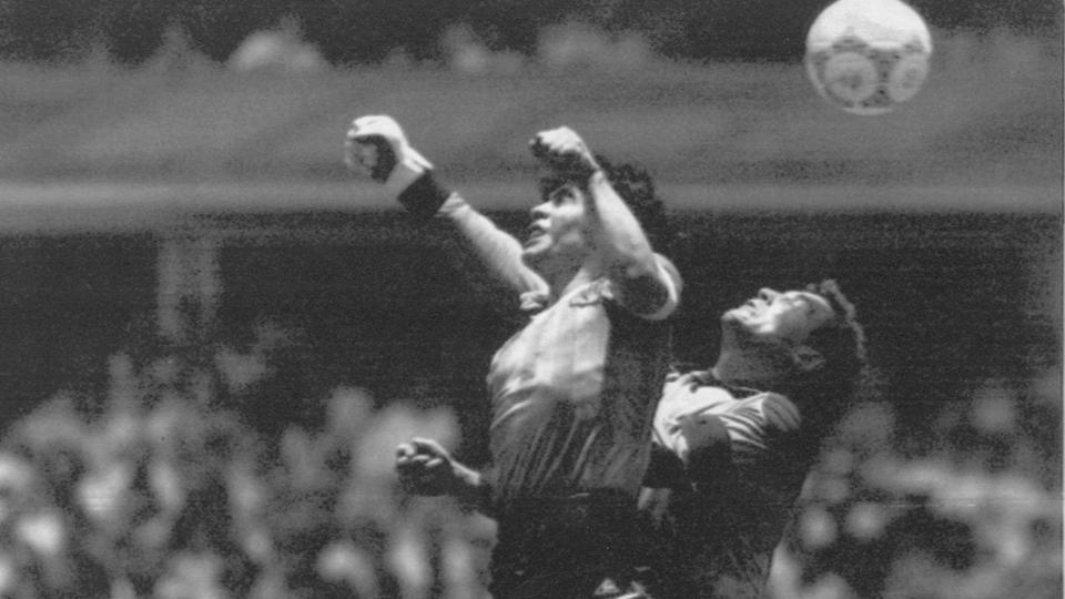 In this June 22, 1986 file photo, Argentina's Diego Maradona, left, beats England's goalkeeper Peter Shilton to a high ball and scores his first of two goals at the World Cup quarterfinal soccer match in Mexico City.