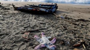 A piece of the boat and a piece of clothing from the deadly refugee shipwreck are seen in Steccato di Cutro near Crotone, Italy, on February 28, 2023.